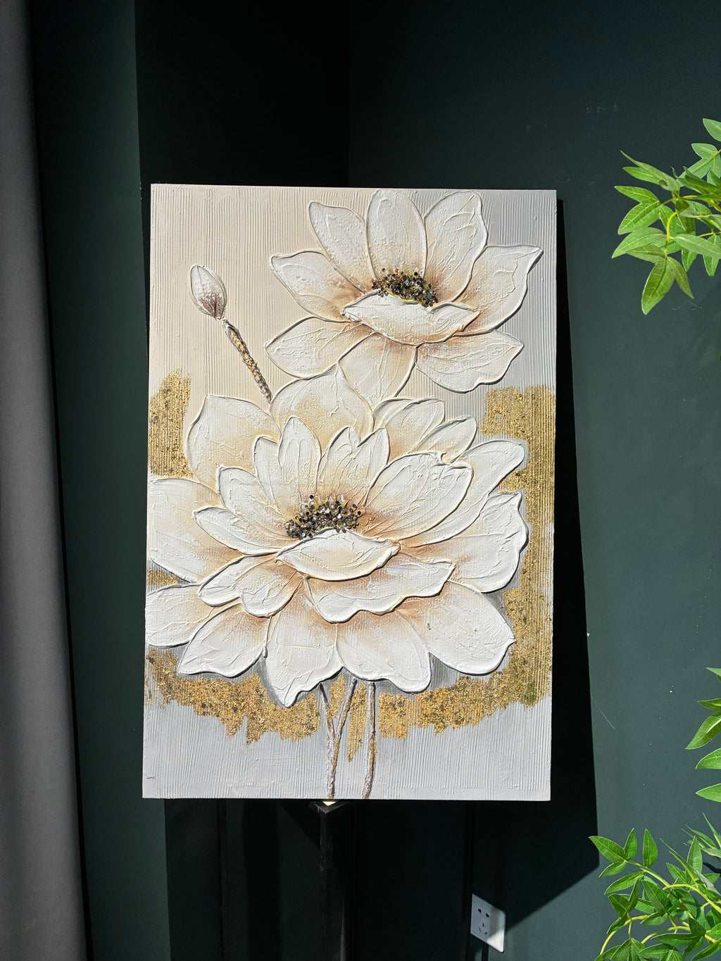 Close detail of the cream impasto petals against metallic gold