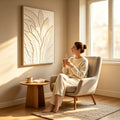Frond Relief canvas in a pale wood frame above a side table in a sunlit reading corner