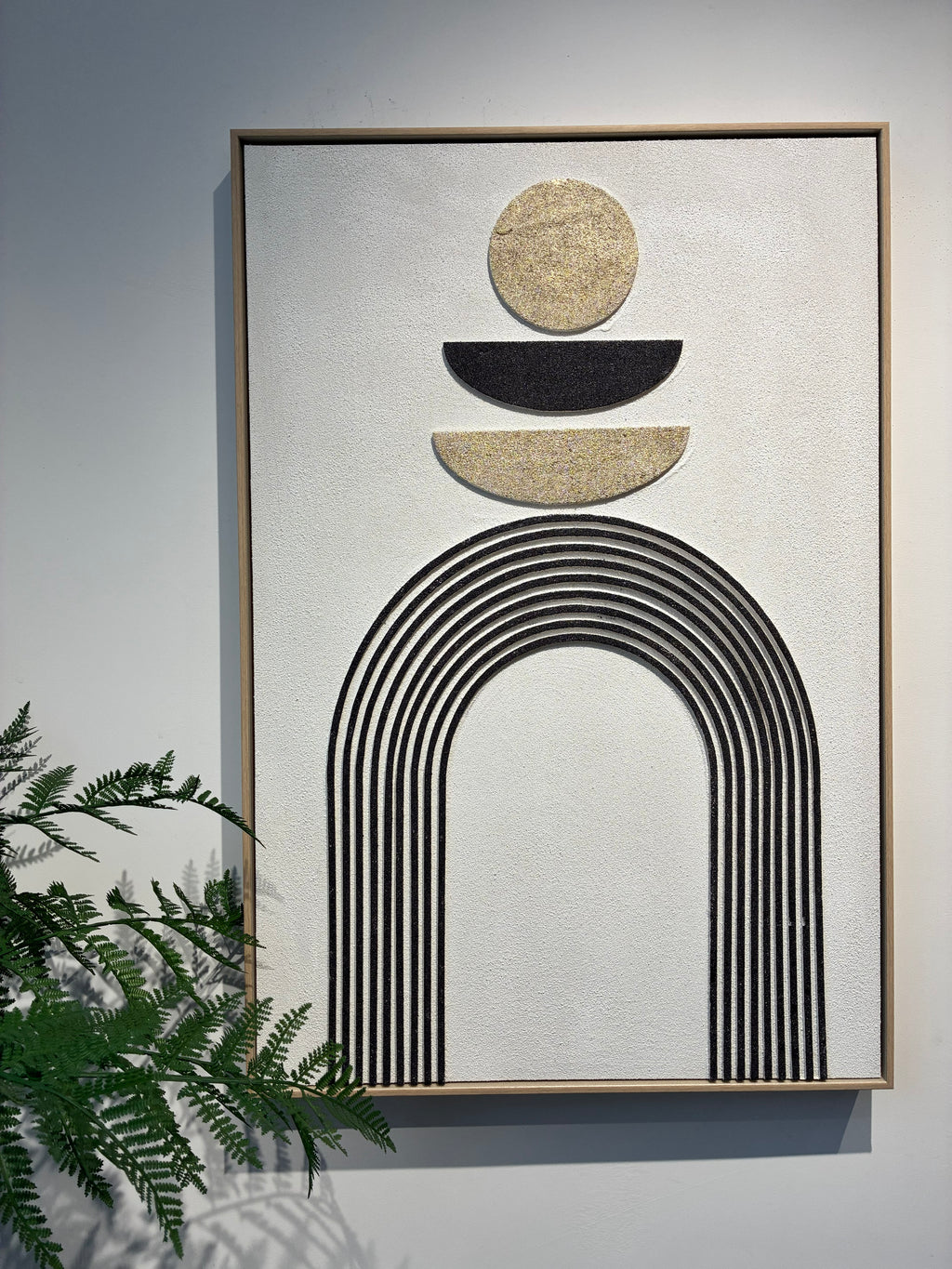 Detail of the metallic gold circle and arch line work