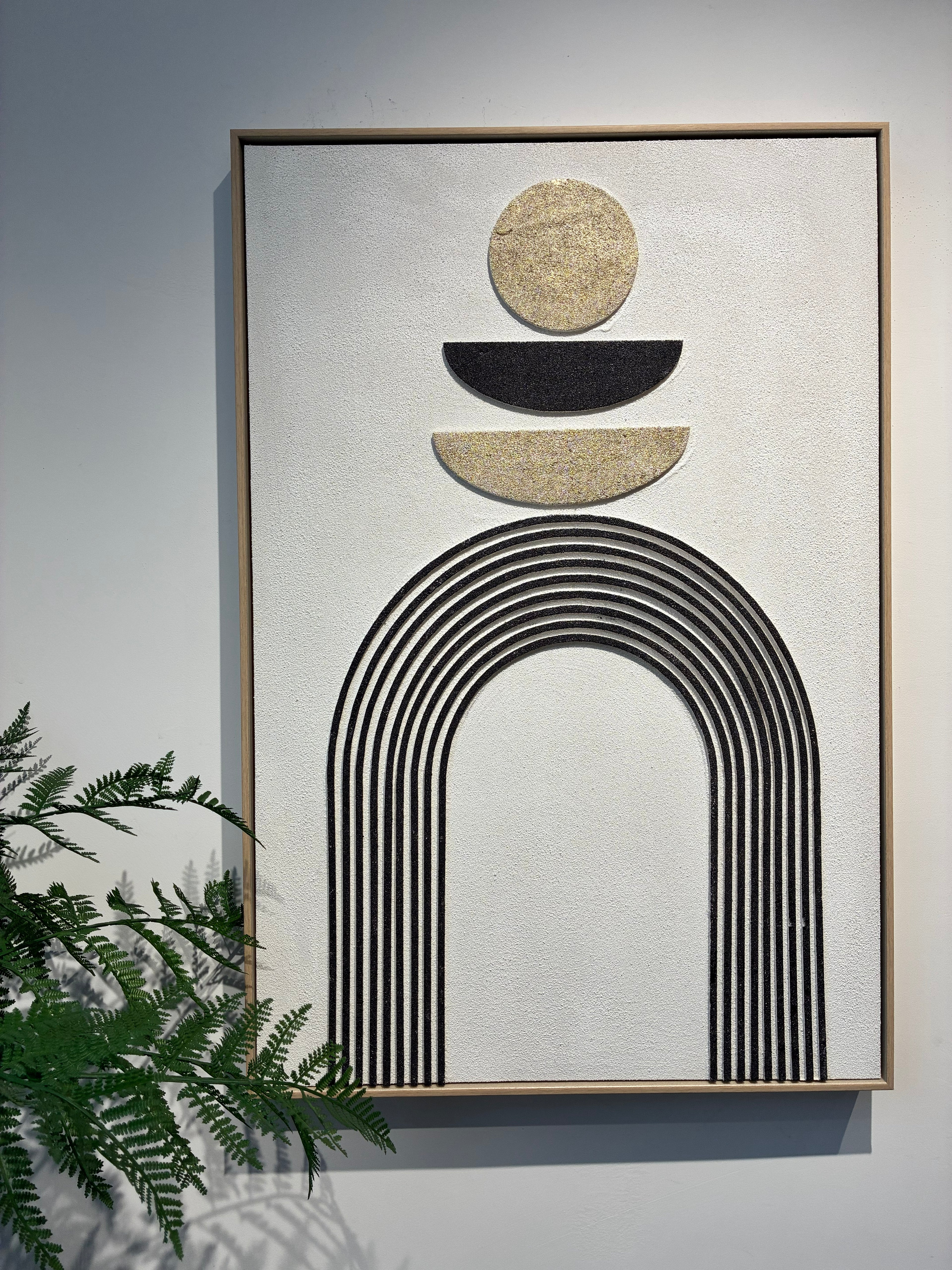 Detail of the metallic gold circle and arch line work