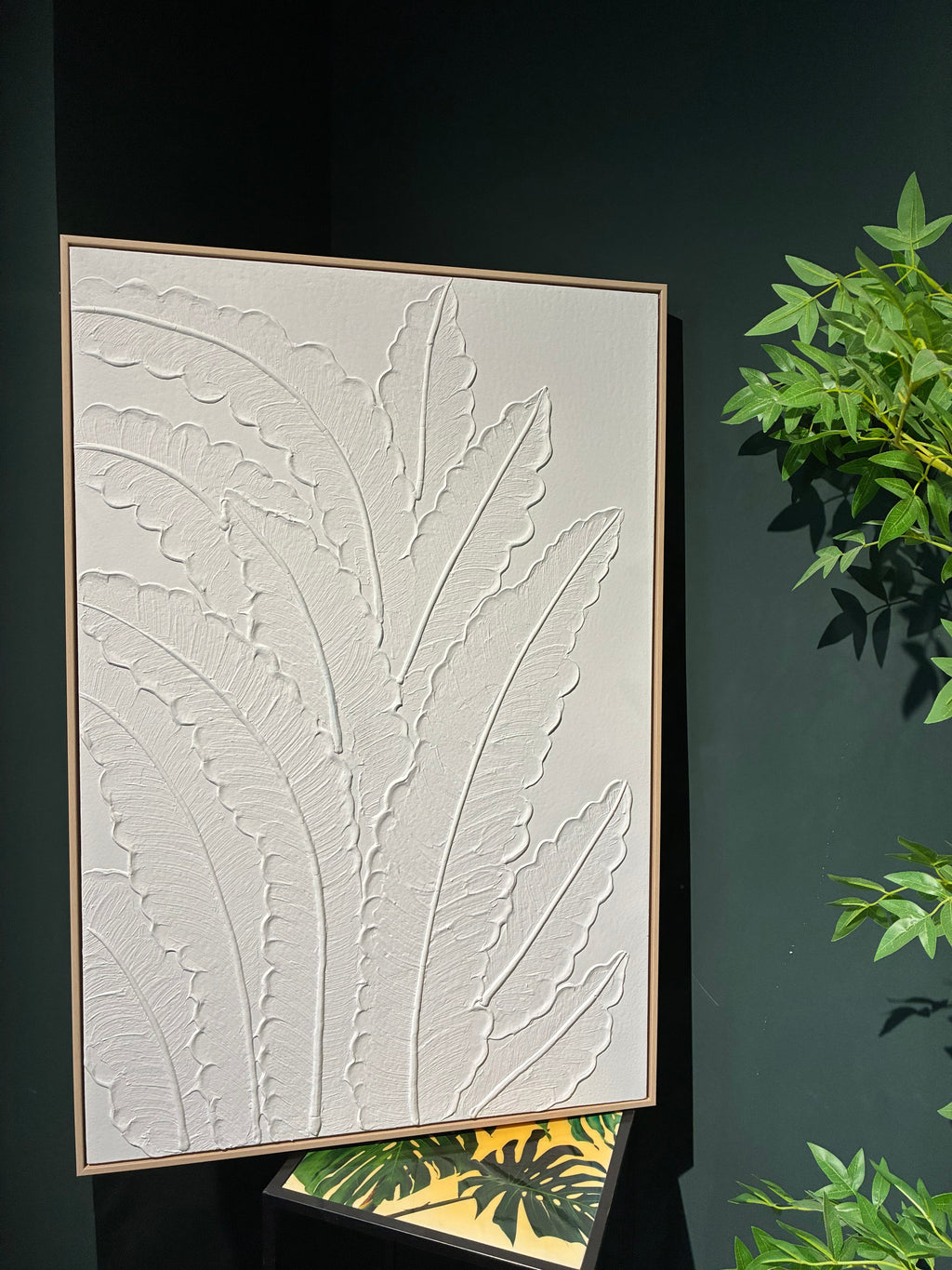 Frond Relief canvas shown in an interior setting