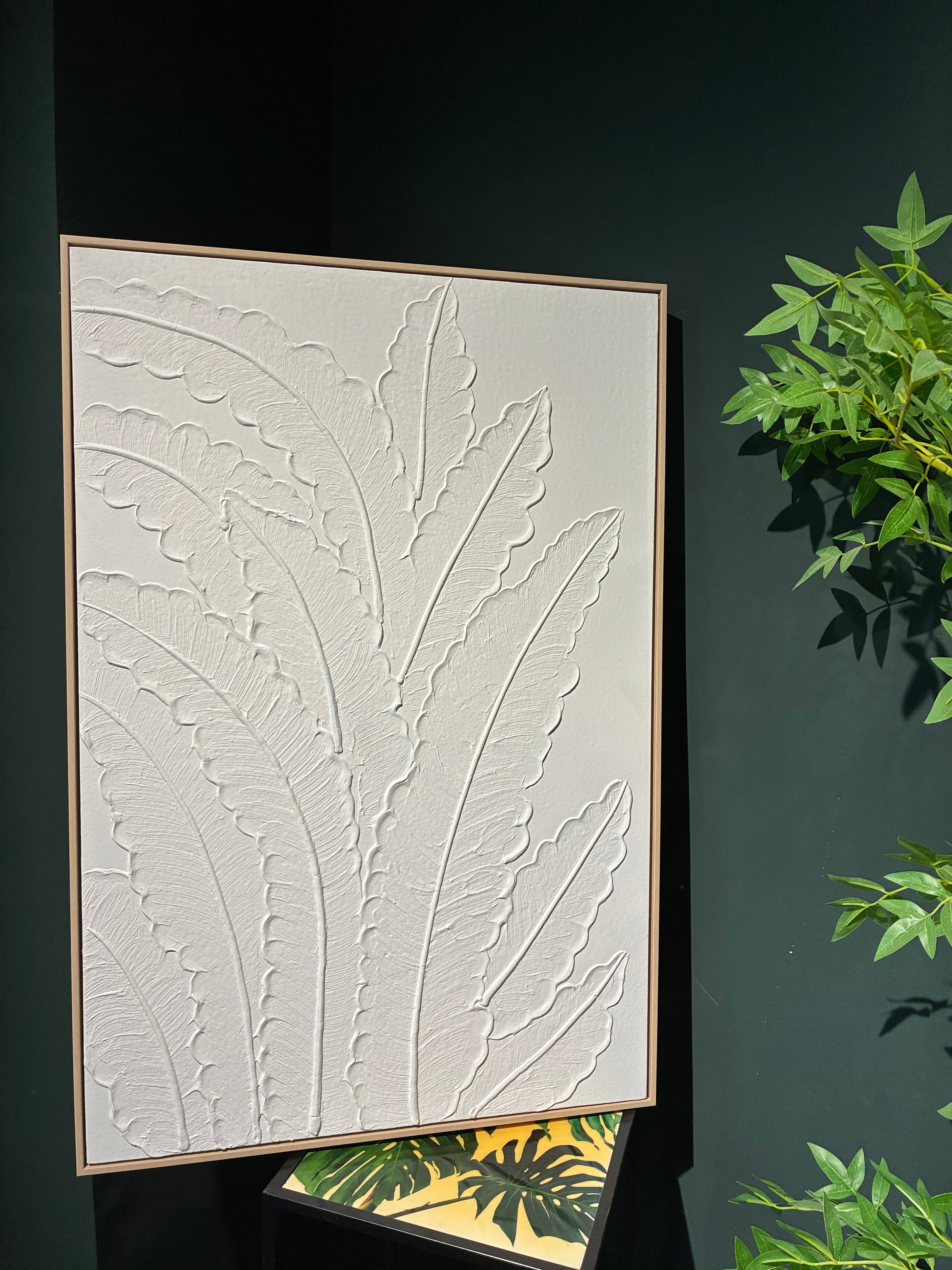 Frond Relief canvas shown in an interior setting