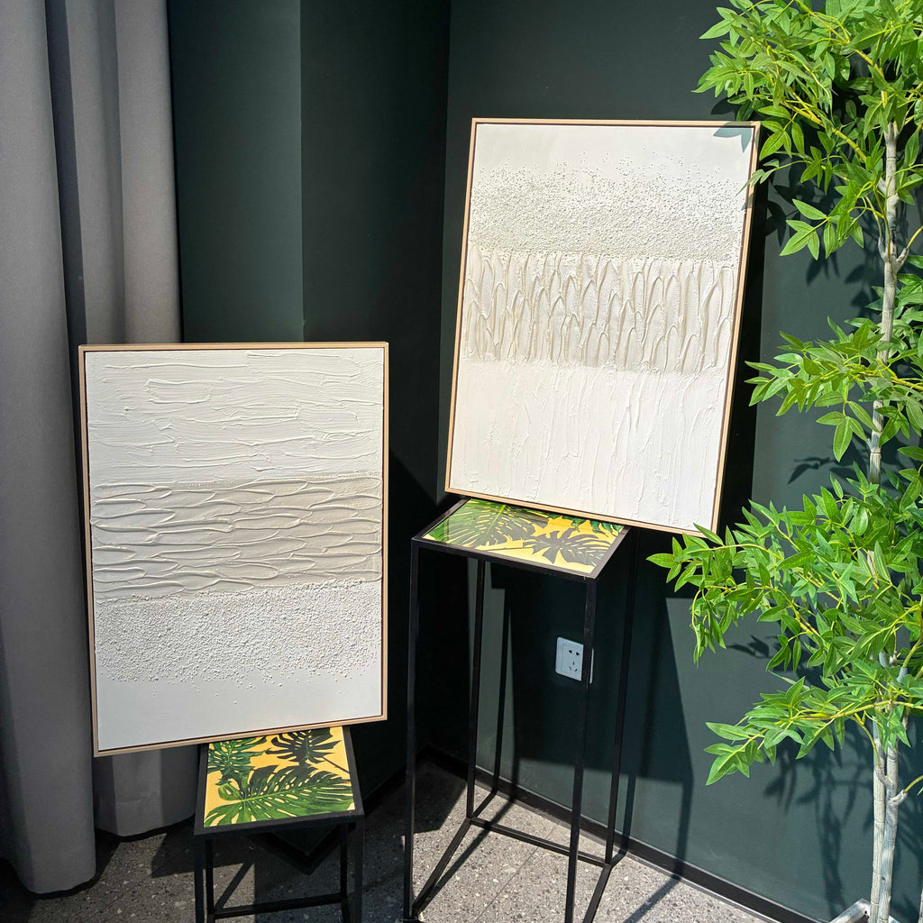 Stone Relief diptych in heavy white texture, hung above a sofa